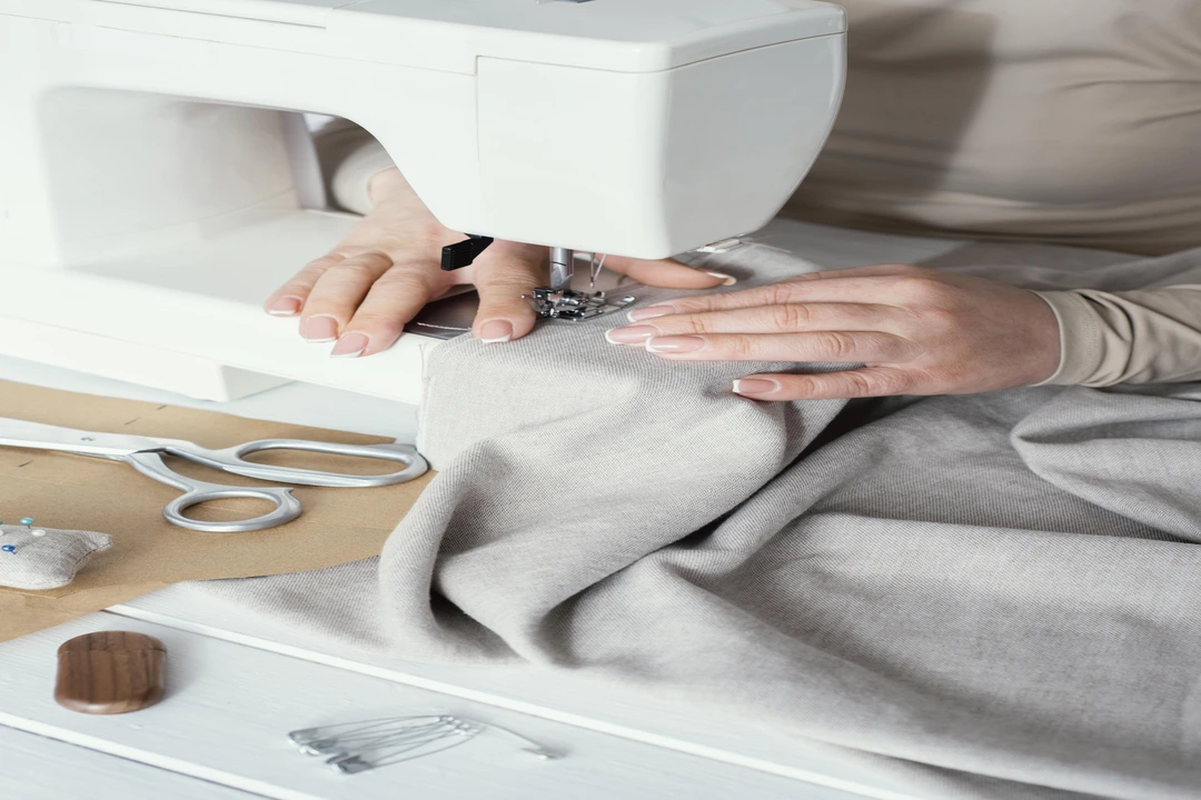 high-angle-seamstress-using-sewing-machine